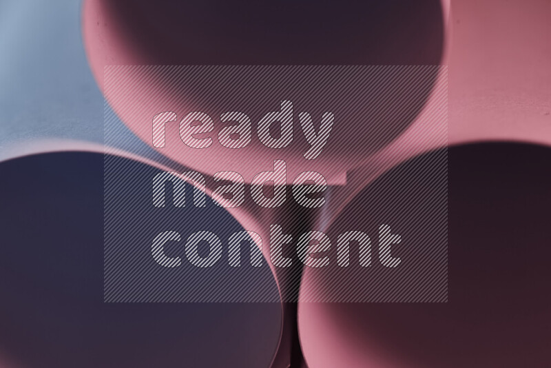 The image shows an abstract paper art with circular shapes in varying shades of blue and pink