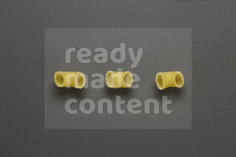 Elbow pasta on grey background