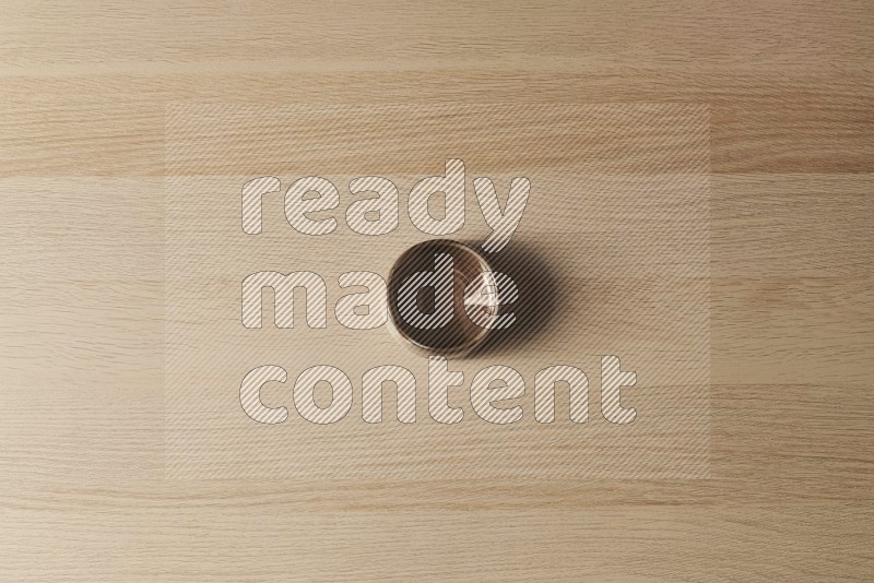Top View Shot Of A Brown Pottery Bowl on Oak Wooden Flooring