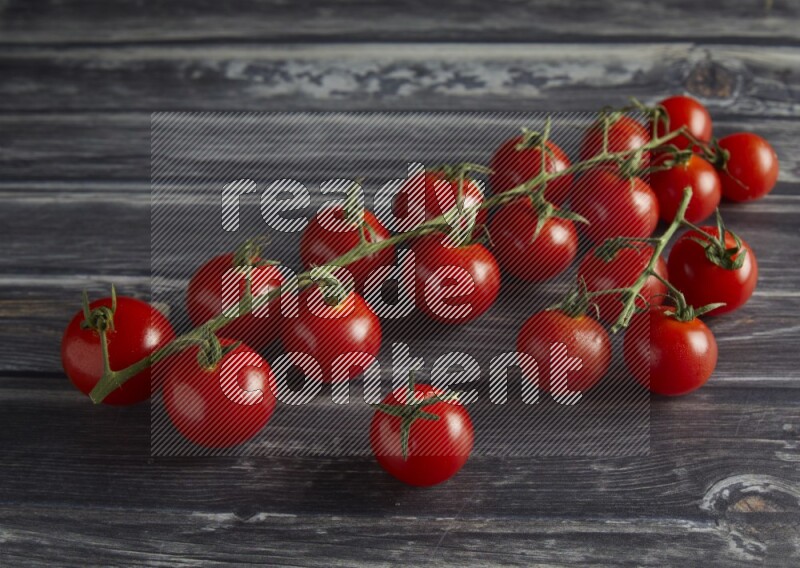 45 cherry tomato vein on a textured grey wooden background