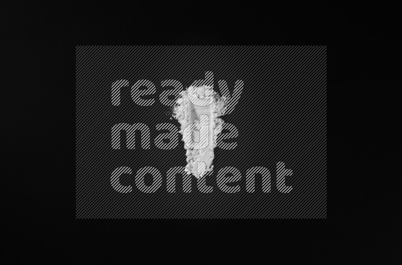 White powder strokes on black background