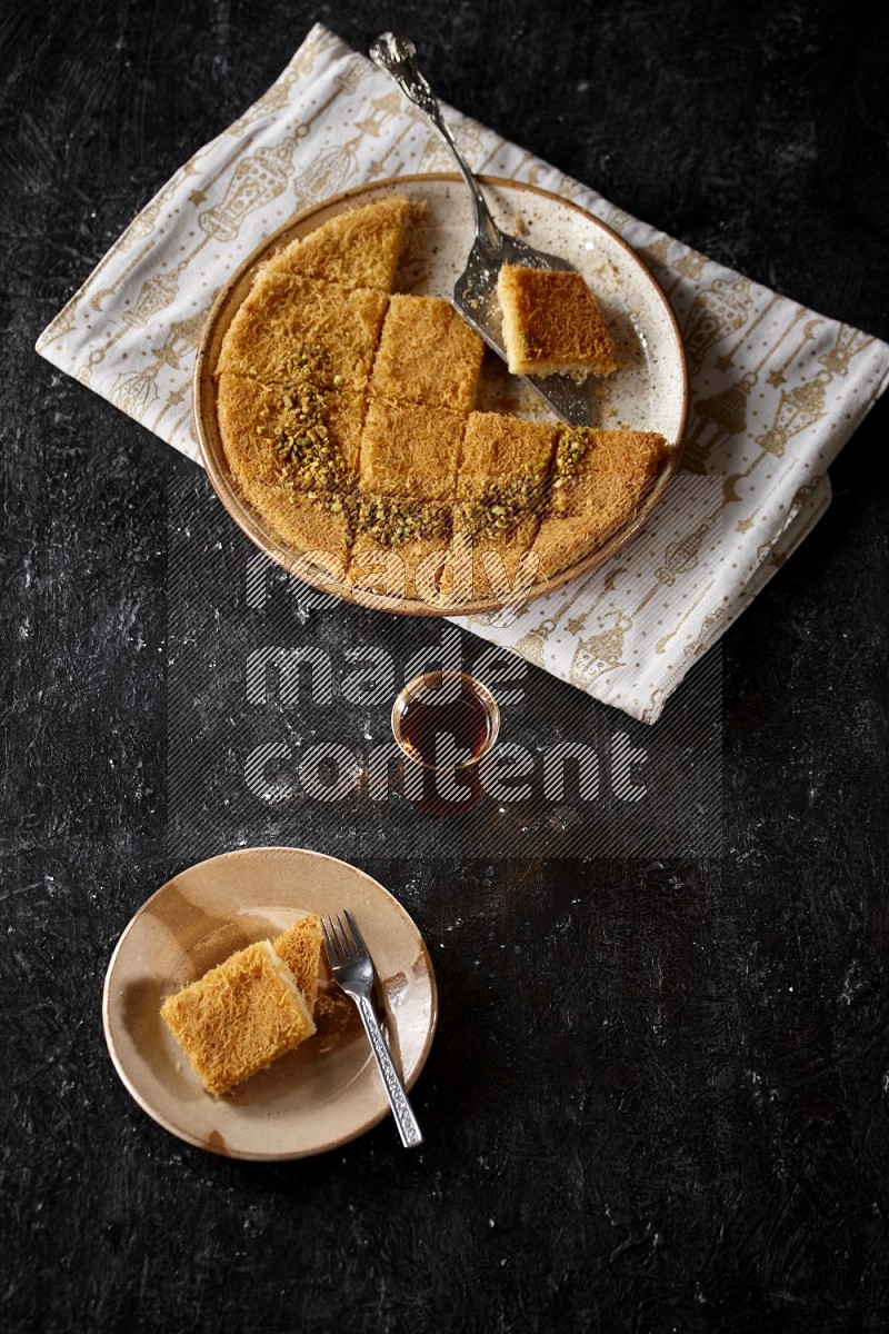 konafa with tea in a dark setup