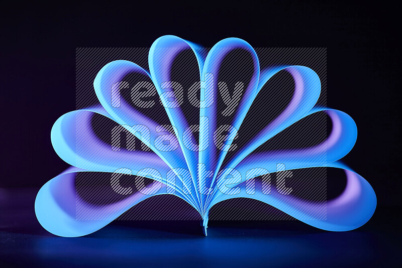An abstract art piece displaying smooth curves in blue and purple gradients created by colored light