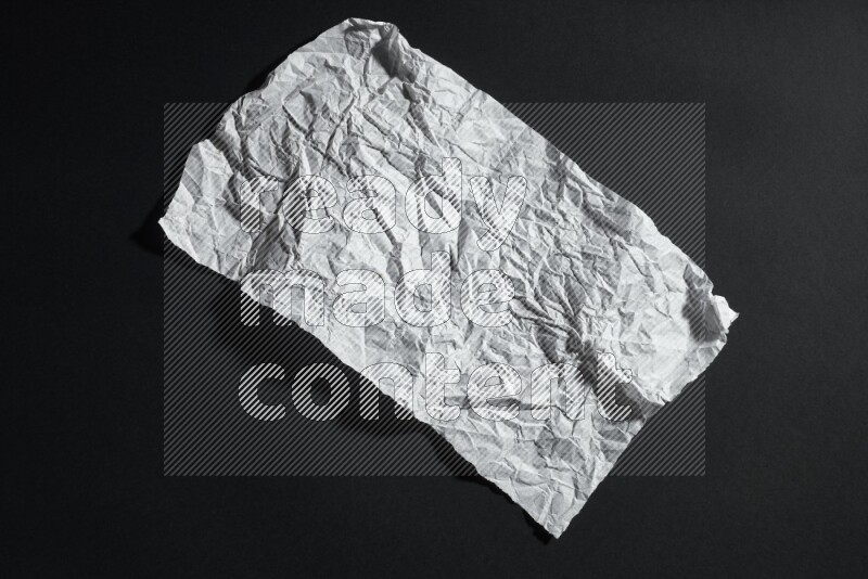 White paper sheet on black background