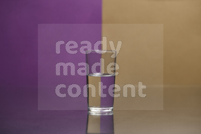 The image features a clear glassware filled with water, set against purple and beige background