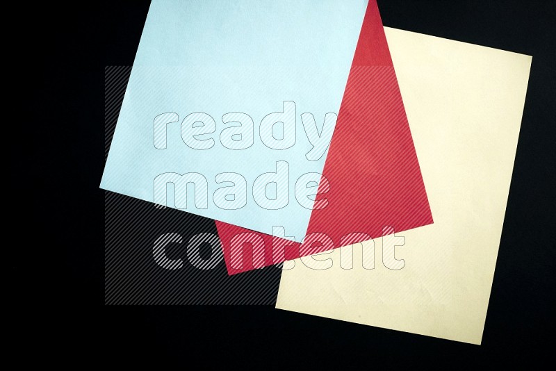 Multicolored paper sheet on black background