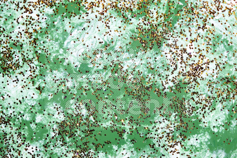 Abstract colorful background with mixed of green and white paint colors with scattered gold glitter
