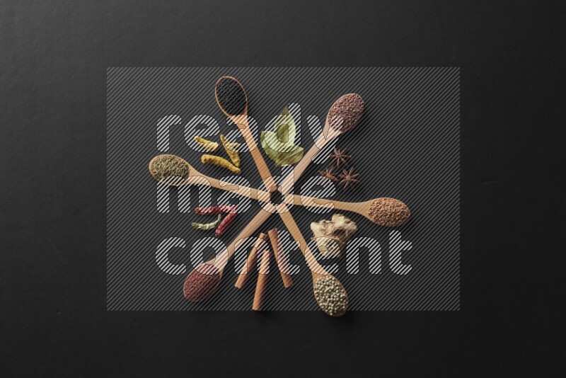 wooden spoons filled with white peppers, mustard seeds, black seeds, garden cress, cumin and flax on black flooring
