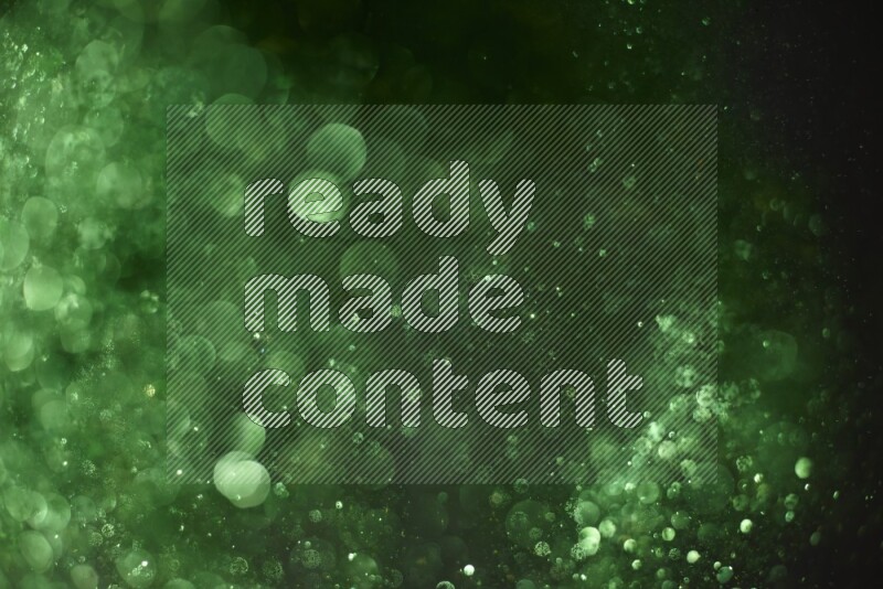 Green glitter powder isolated on black background