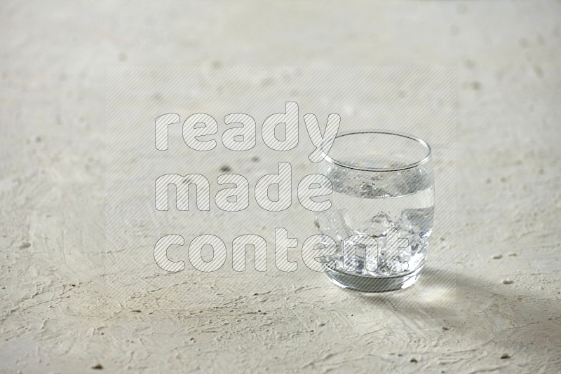 Cold drinks in a glass cup such as water, tamarind, qamar eldin, sobia, milk and hibiscus on textured white background