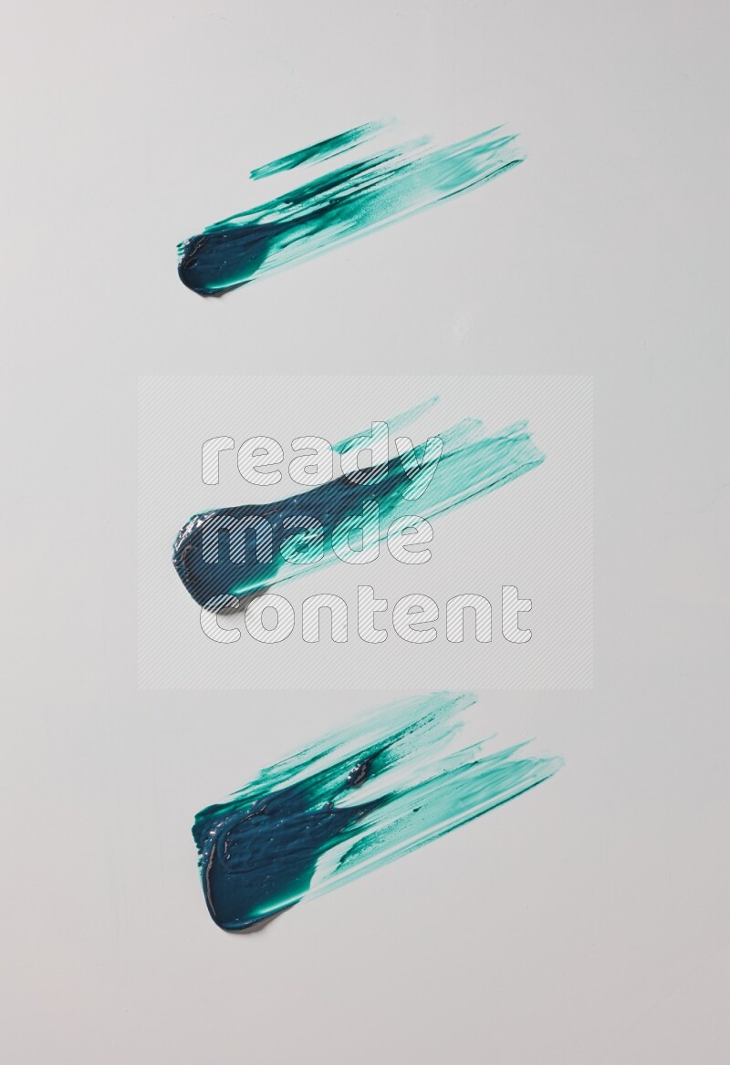 Turquoise painting knife strokes on white background