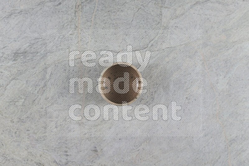 A multicolored pottery Bowl on grey marble background