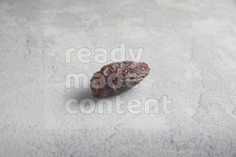 one madjoul date on a light grey background