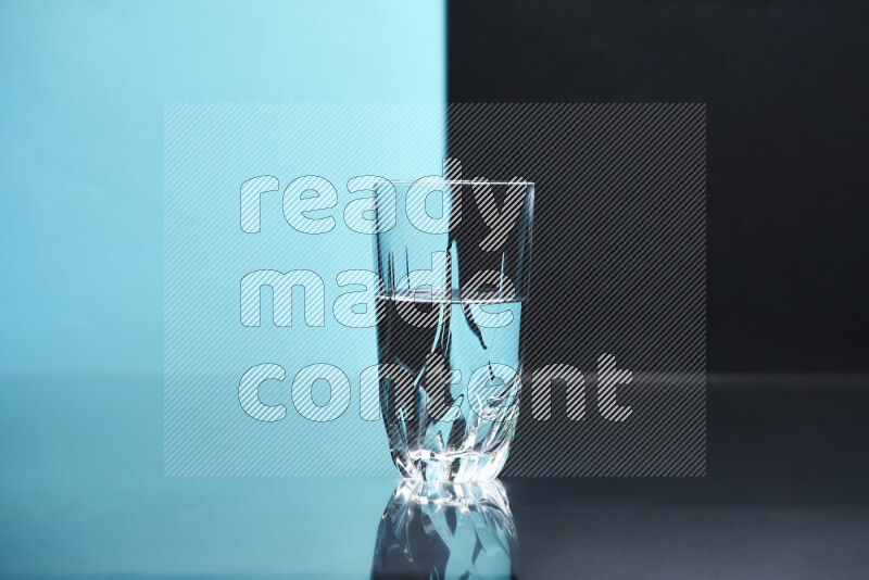 The image features a clear glassware filled with water, set against light blue and black background