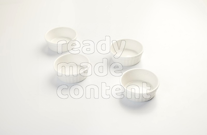 white ceramic round sauce dish on white countertop