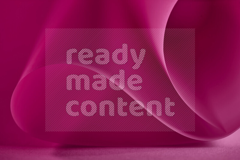 فن تجريدي يعرض منحنيات وتدرجات اللون الوردي مكونه بضوء ملون