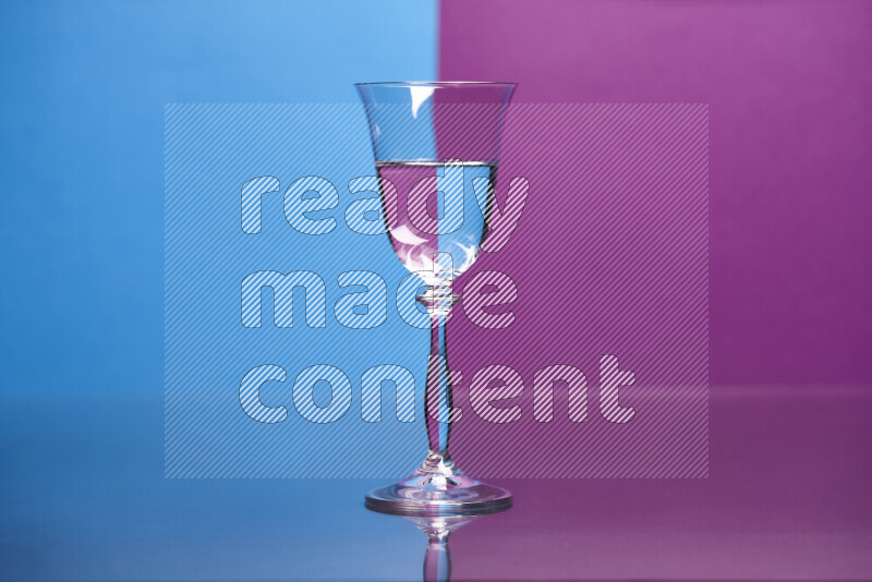 The image features a clear glassware filled with water, set against blue and purple background