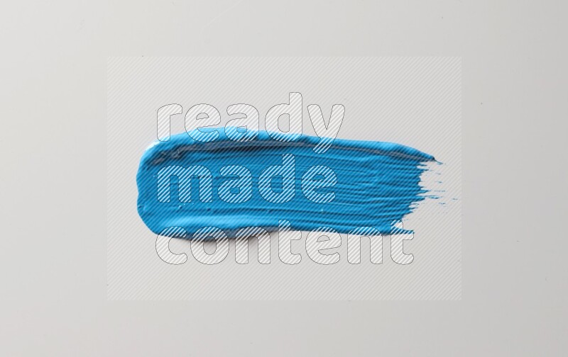 A single blue straight line brush stroke on a white background