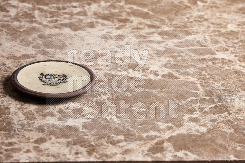 Decorative Pottery Plate on Beige Marble Flooring