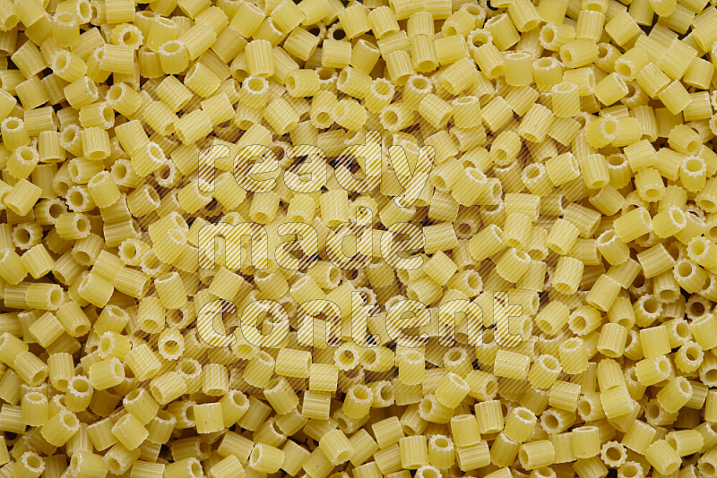 Small rings pasta on grey background