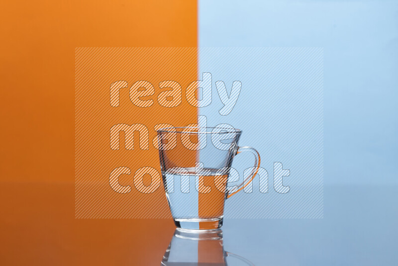 The image features a clear glassware filled with water, set against orange and light blue background