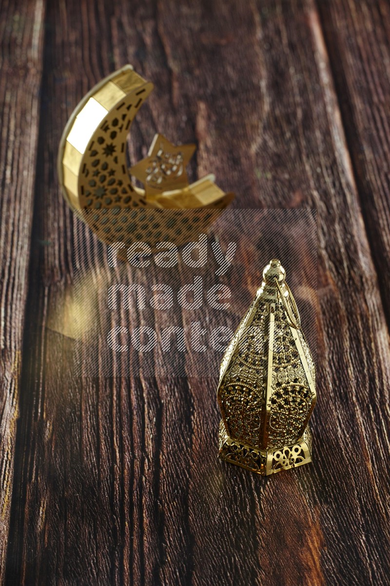 A crescent lantern with classic lantern on brown wooden background