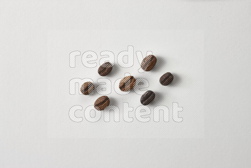 Roasted coffee beans on white background