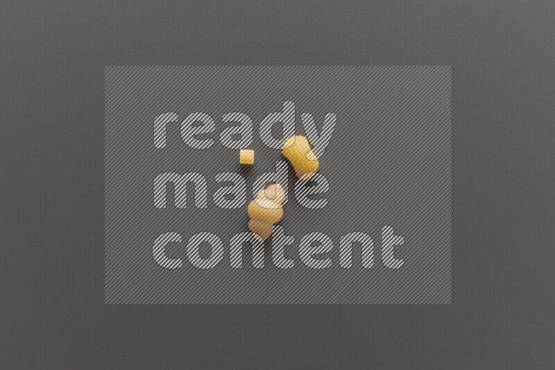 Different pasta types on grey background
