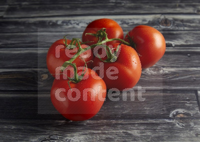 45 degree vein of roma tomato tomato on a textured grey wooden background