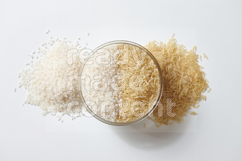 White rice with golden rice on white background