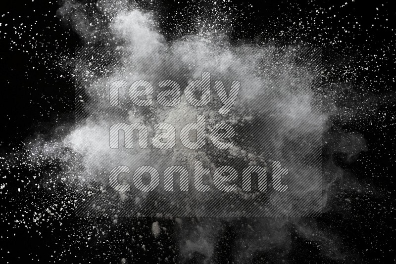 White powder explosion on black background