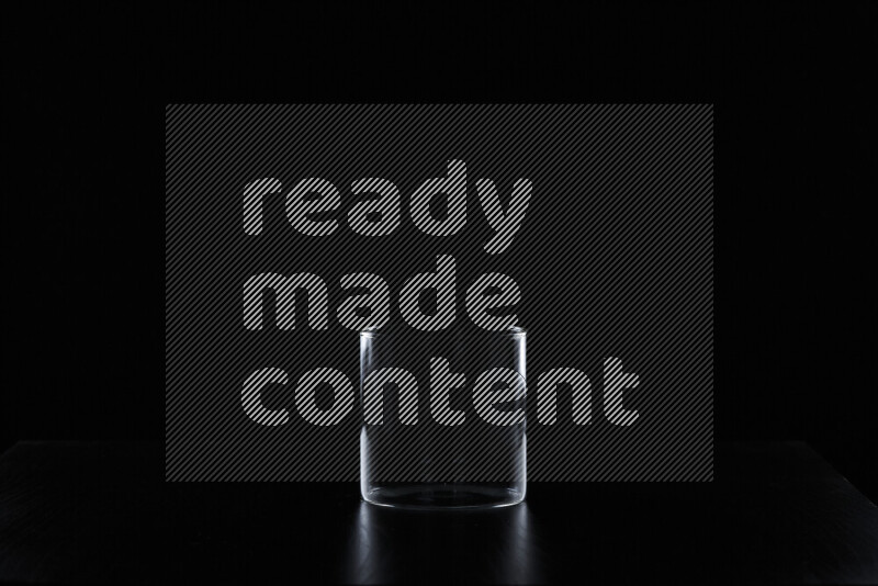 Glassware with rim light against black background