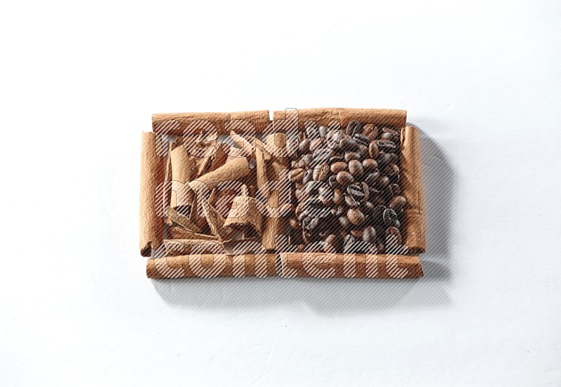 2 squares of cinnamon sticks full of coffee beans and cinnamon on white flooring