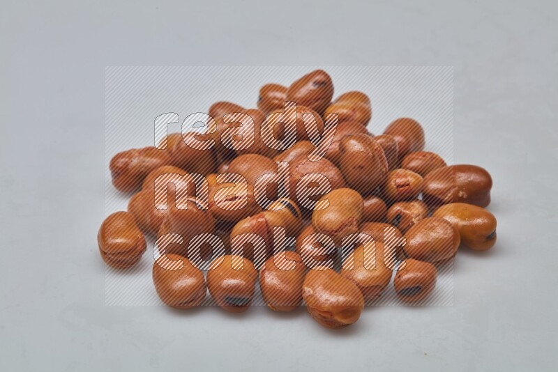 Close up shot of cooked fava beans (foul) on white background