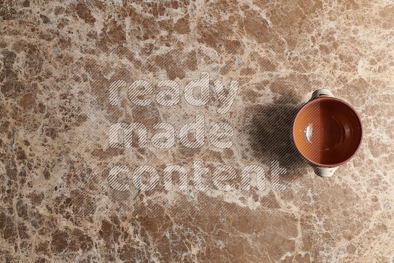 Top View Shot Of A Multicolored Pottery pot On beige Marble Flooring