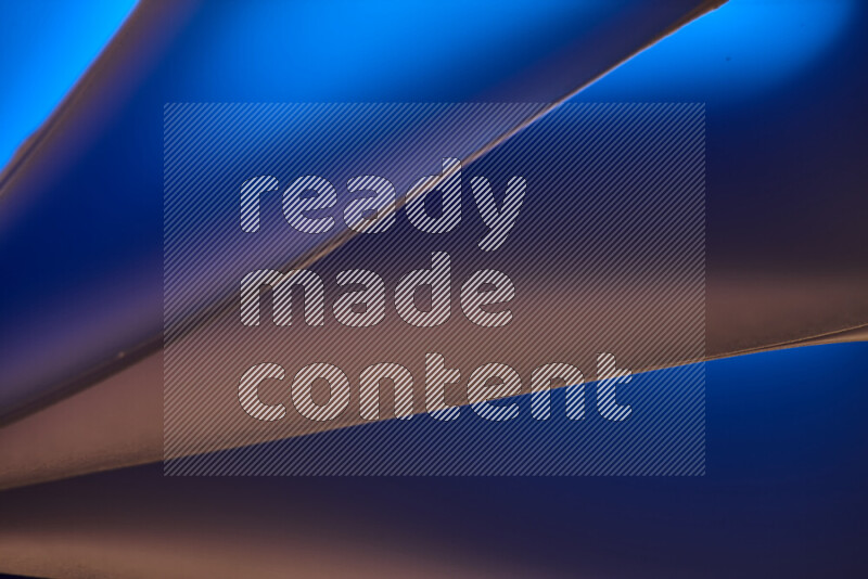 An abstract art piece displaying smooth curves in warm and cold gradients created by colored light