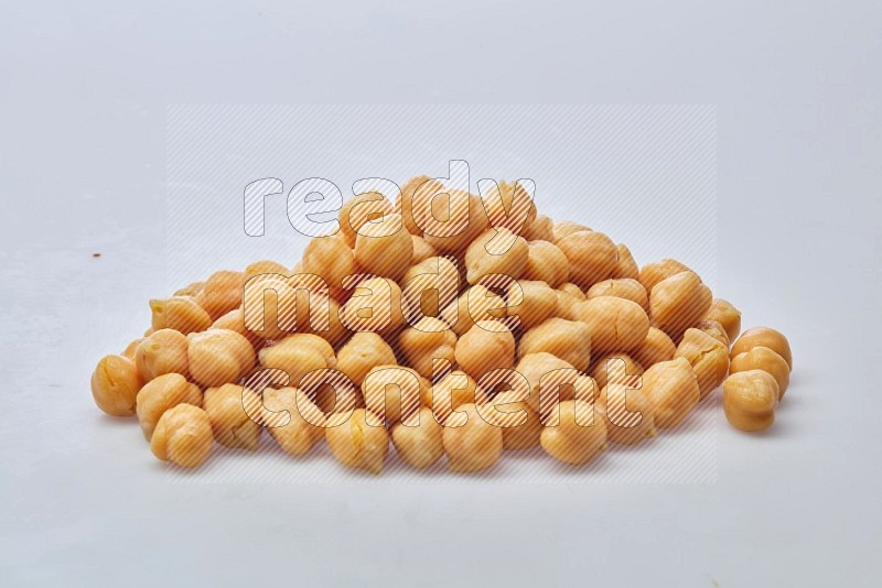 Close up shot of boiled chickpeas on white background
