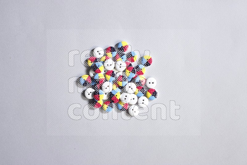 Multicolored buttons on grey background