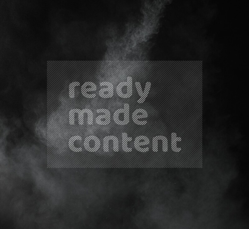 A side view of green powder explosion on black background