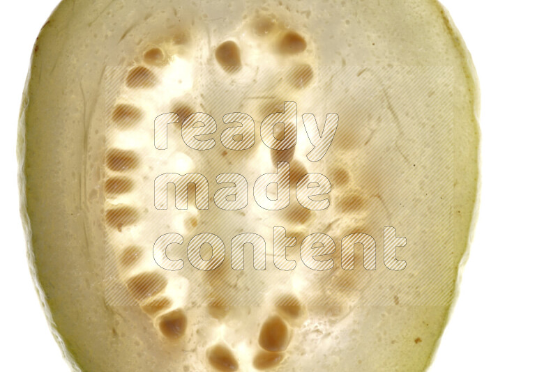 Guava slices on illuminated white background