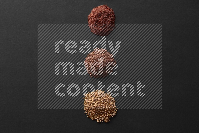 حبة البركة و حبوب الخردل وحبوب الكتان وحب الرشاد علي خلفية سوداء