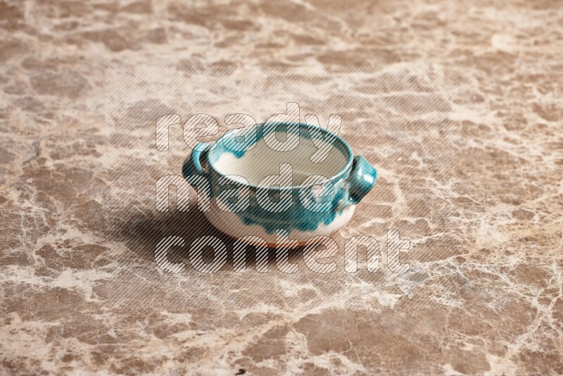Multicolored Pottery Bowl on Beige Marble Flooring