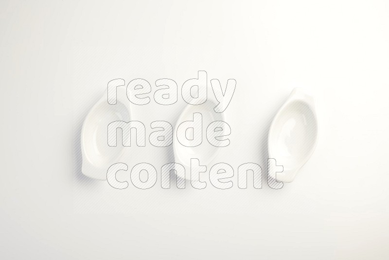 white ceramic oval sauce dish on white countertop