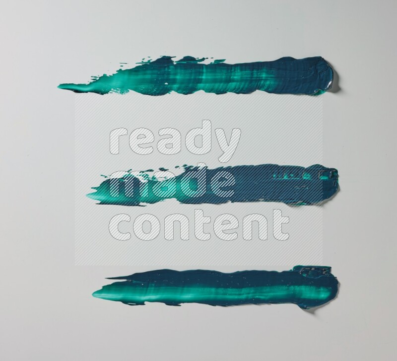 Turquoise painting knife strokes on white background