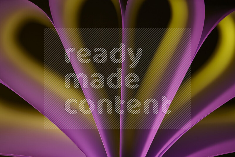 فن تجريدي يعرض منحنيات وتدرجات اللون الأصفر والوردي مكونه بضوء ملون