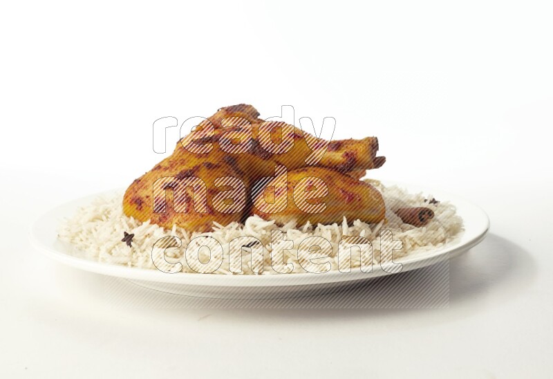 white  basmati Rice with  kabsa chicken pieces  on a white rounded plate direct on white background