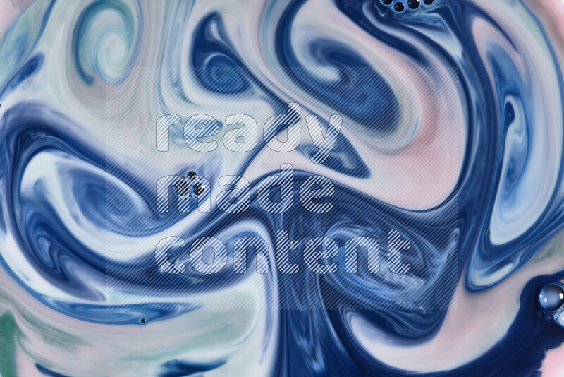 لقطة مقربة لأنماط دوامية باللون الأحمر والأخضر والأبيض والأزرق