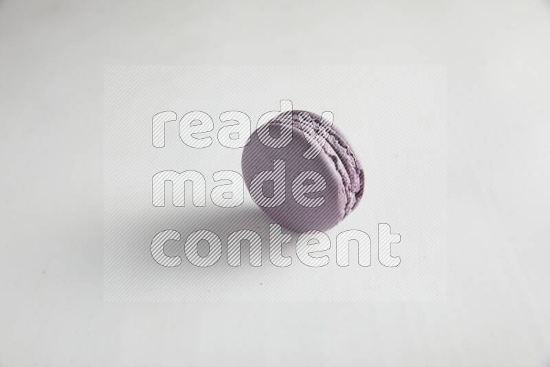 45º Shot of Purple Blueberry macaron on white background