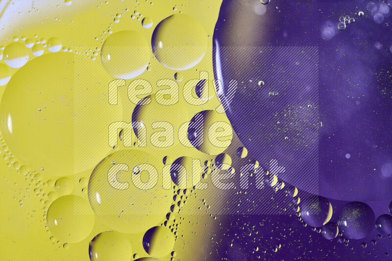 Close-ups of abstract oil bubbles on water surface in shades of purple and yellow