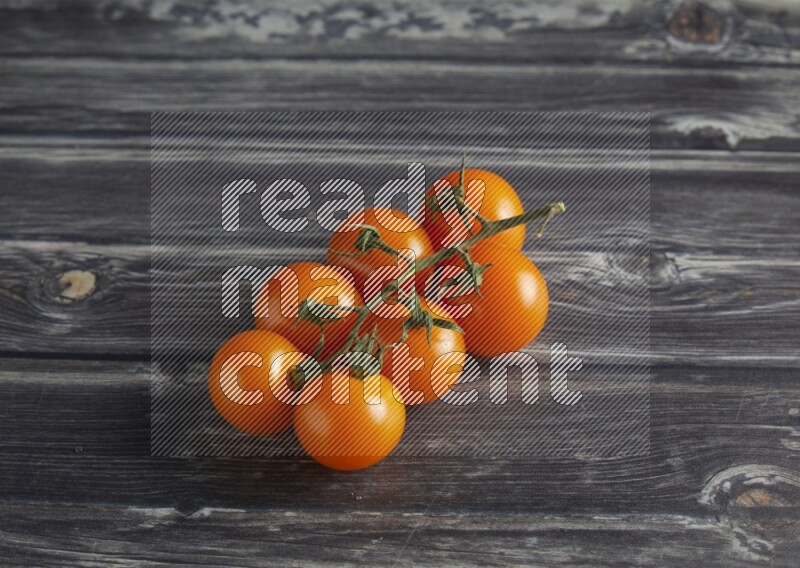 45 cherry tomato vein on a textured grey wooden background